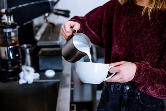 canva woman pouring milk on cup