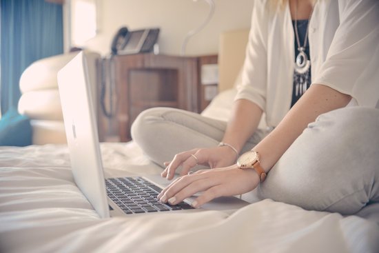 canva woman using gray laptop computer MADGyOGv75Q