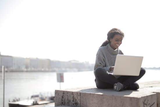 canva woman using laptop outdoors MAD2R nNN0E