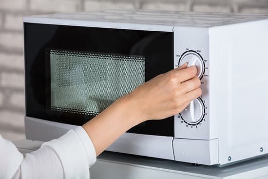 canva woman using microwave oven MADer9tXzlg