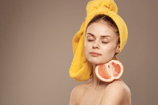 canva woman with grapefruit in hands naked shoulders and skin care vitamins MAEL7ApuD70