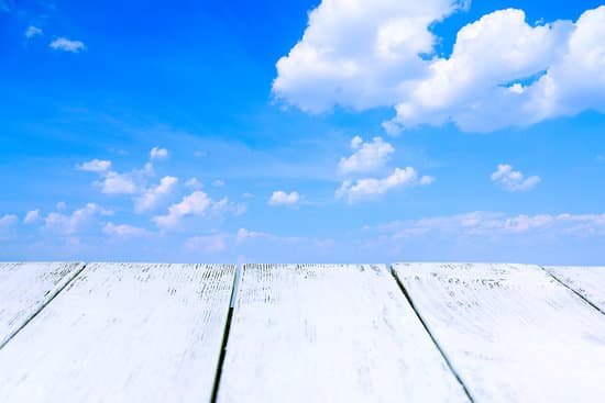 canva wooden board on cloudy sky background MAD6rQ9bOaU
