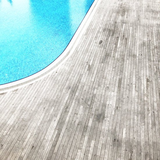 canva wooden floor beside pool MADGvspdbe0