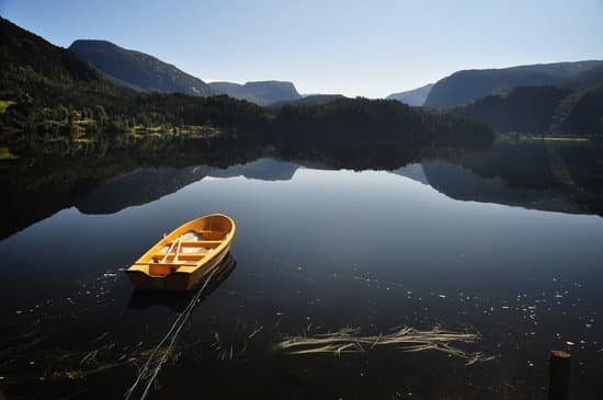 canva yellow boat on the lake MAAt9RP dTA