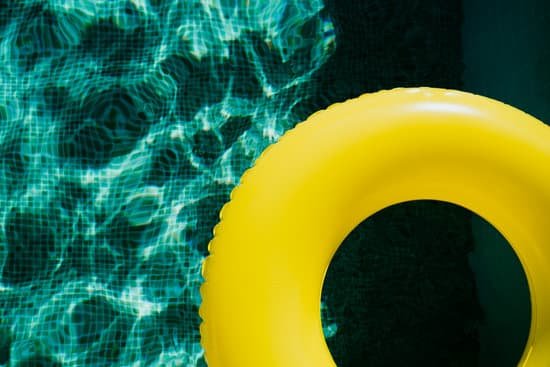 canva yellow inflatable donut floating on a swimming pool MAECjD9Y6m8