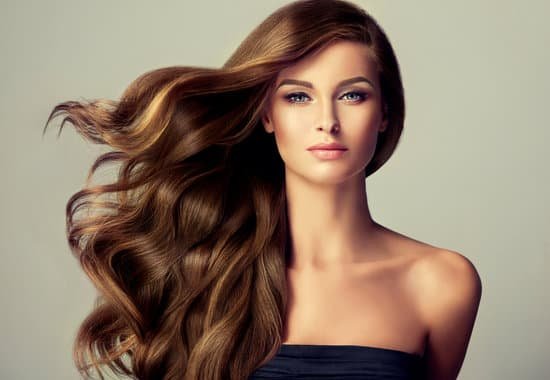 canva young brown haired beautiful model with long wavywell groomed hair. flying hair. MADer2u96bI