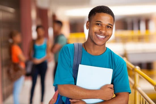 canva young college boy holding books MADara2fjbQ