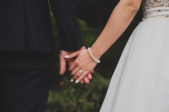 canva young married couple holding hands MADaA