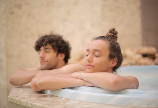 canva young satisfied couple relaxing at spa bathtub during vacation MAD8VygAQHU