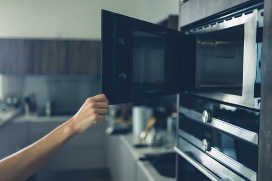 canva young woman opening the microwave MACed1FPncs